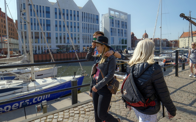 30 The waterfront area of Gdańsk Old Town in Poland, featuring modern buildings alongside the Motława River